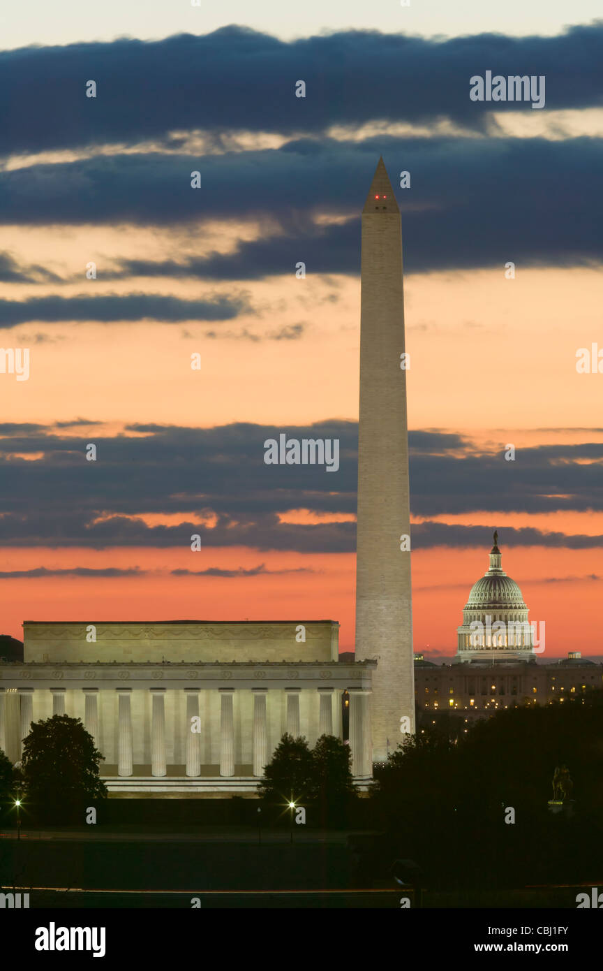 The Lincoln Memorial, Washington Monument, and US Capitol Building illuminated during morning twilight in Washington, DC. Stock Photo