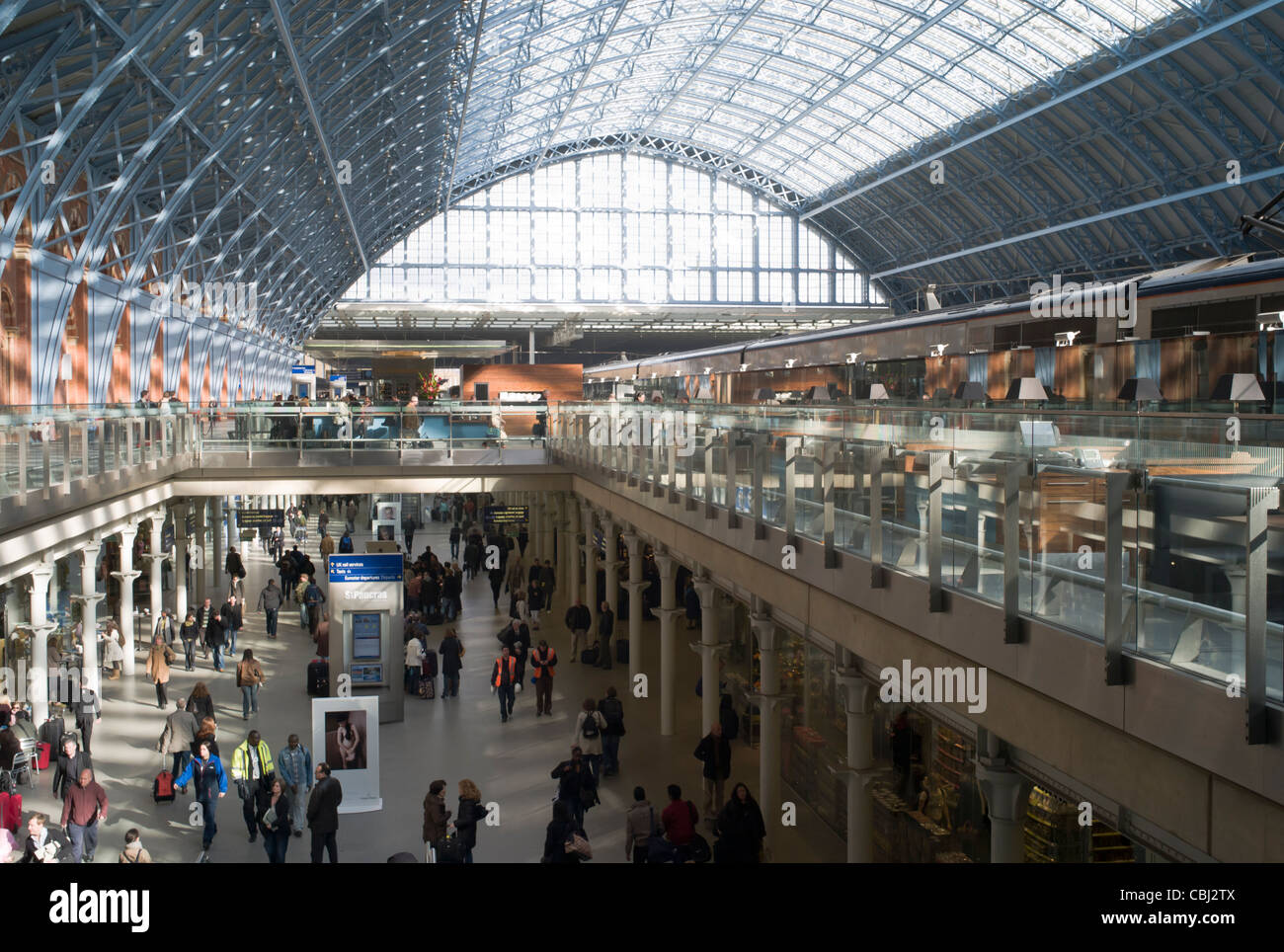 The interior of St. Pancras station, with Eurostar trains on the upper level in London, England, UK. Stock Photo