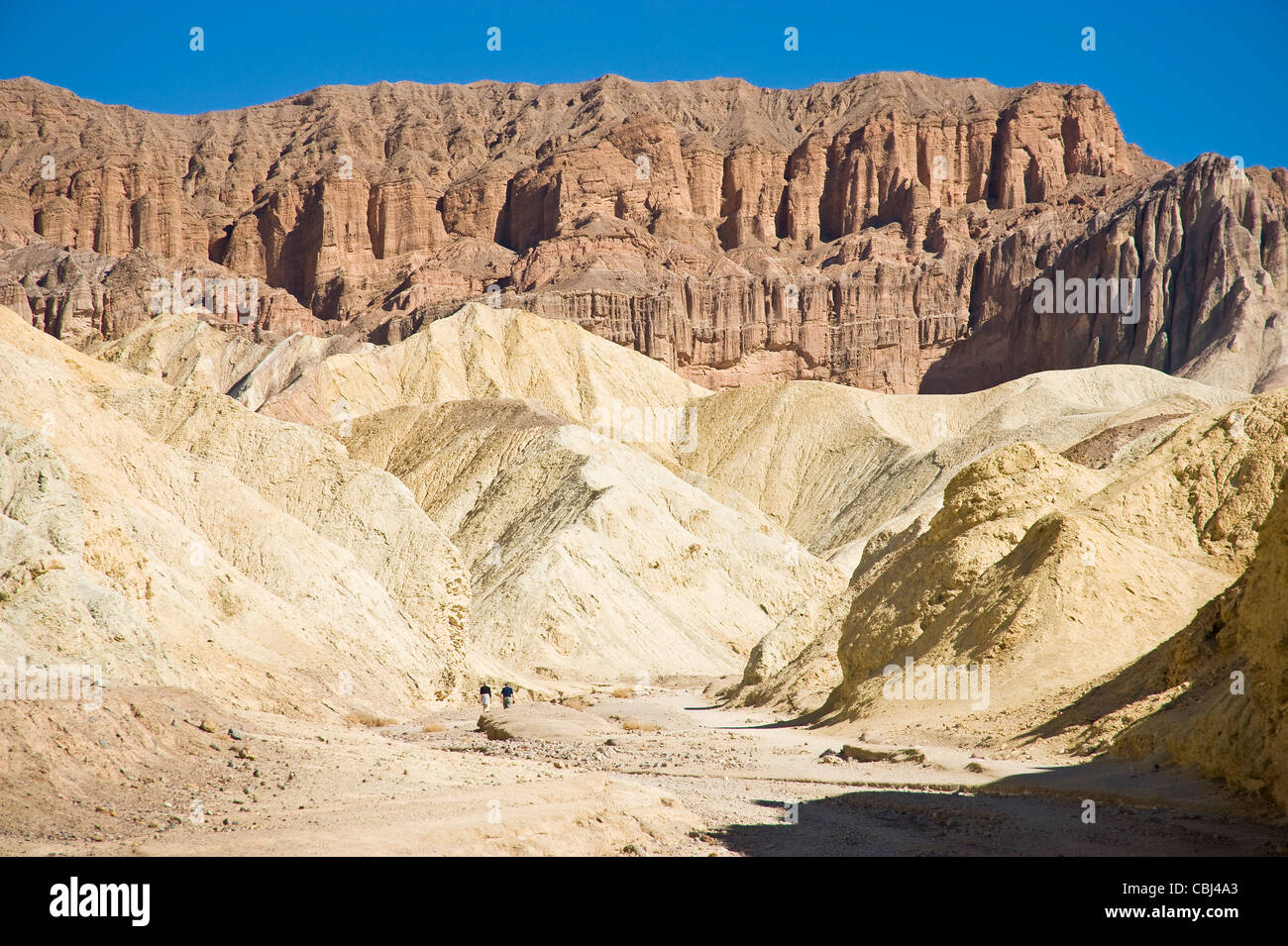 Hikers In Golden Canyon, Death Valley National Park, USA Stock Photo ...