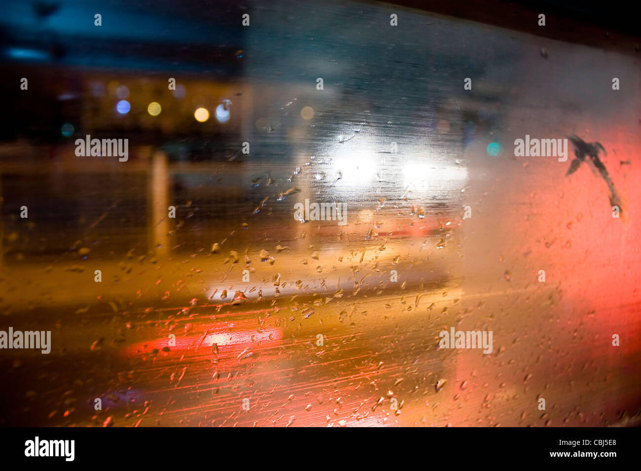 Rainy night lights out the window of the streamer Stock Photo
