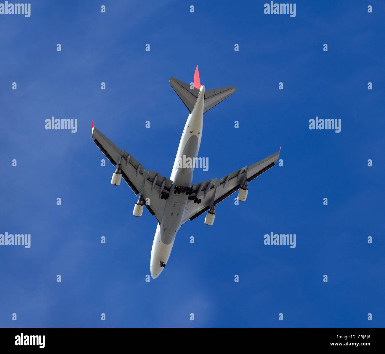 Aircraft flying against the blue sky Stock Photo - Alamy