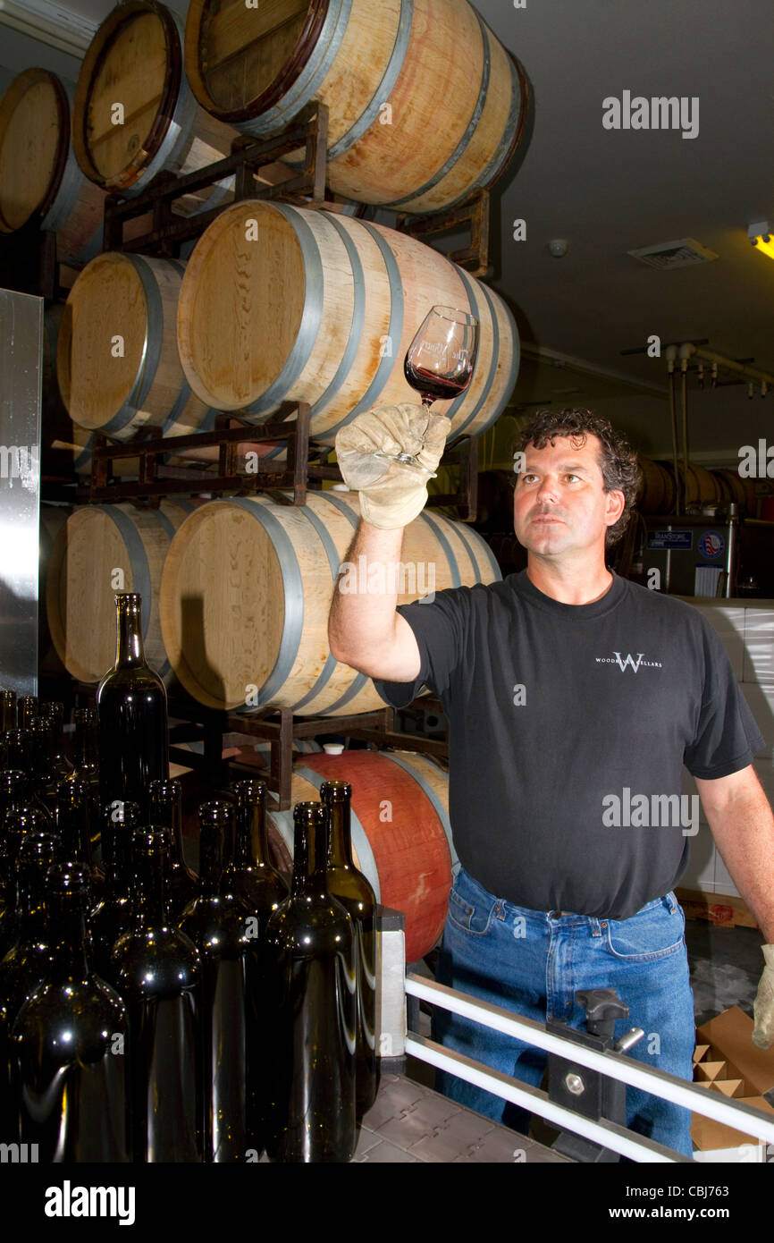Wine maker tasting red wine at Woodriver Cellars in Eagle, Idaho, USA. Stock Photo