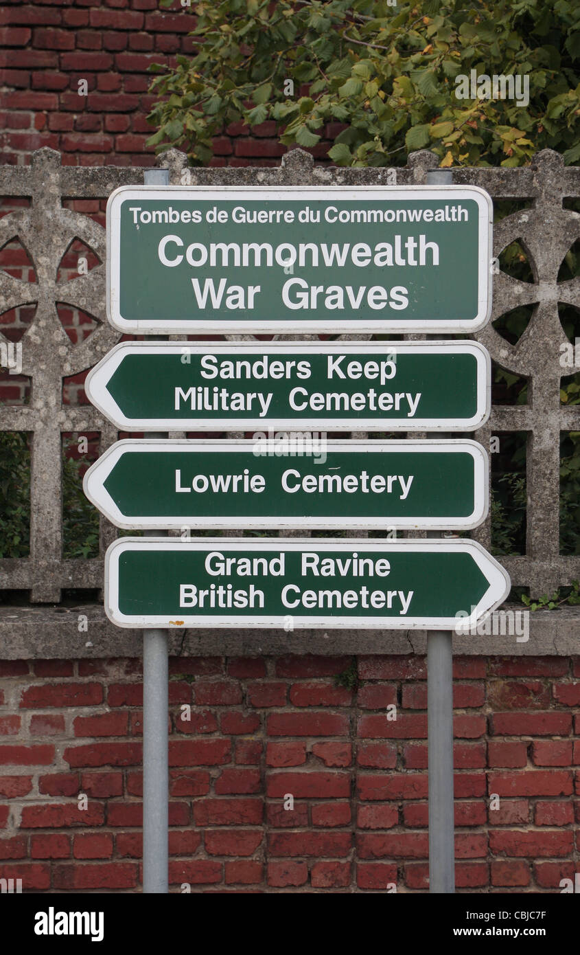 Standard Commonwealth War Graves signposts pointing to three CWGC cemeteries in Havrincourt, Nord-Pas-de-Calais, France. Stock Photo