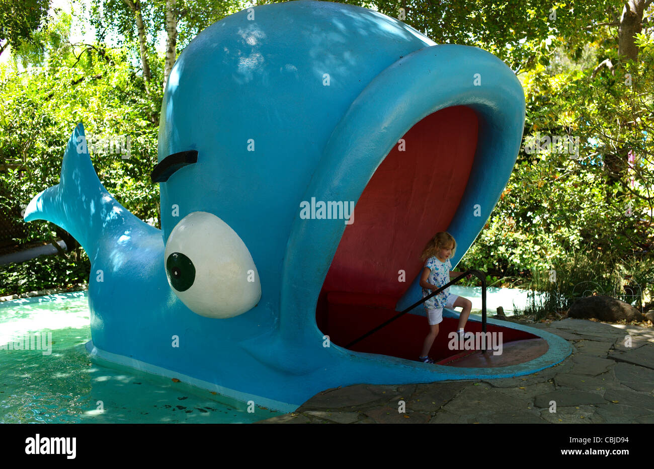 A child emerges from a whale in Fairyland Stock Photo