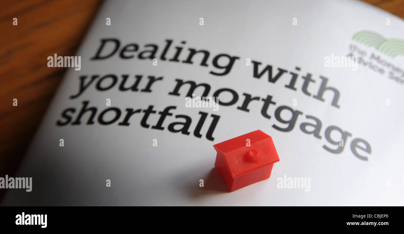 DEALING WITH YOUR MORTGAGE SHORTFALL INFO LEAFLET WITH MODEL HOUSE RE ENDOWMENT MORTGAGE SHORTFALL MORTGAGES NEGATIVE EQUITY UK Stock Photo