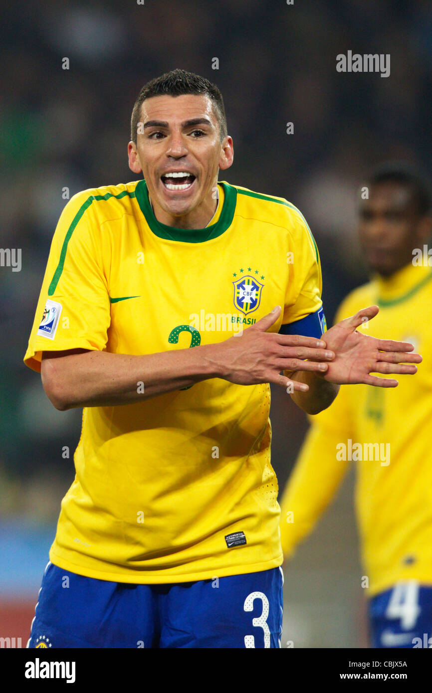 Brazil team captain Lucio gestures during a 2010 FIFA World Cup match against Côte d'Ivoire at Soccer City Stadium. Stock Photo