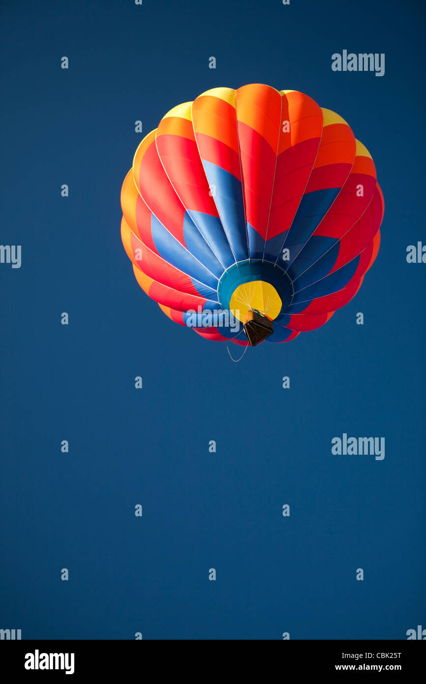 Hot Air Balloon in flight, clear blue sky Stock Photo - Alamy