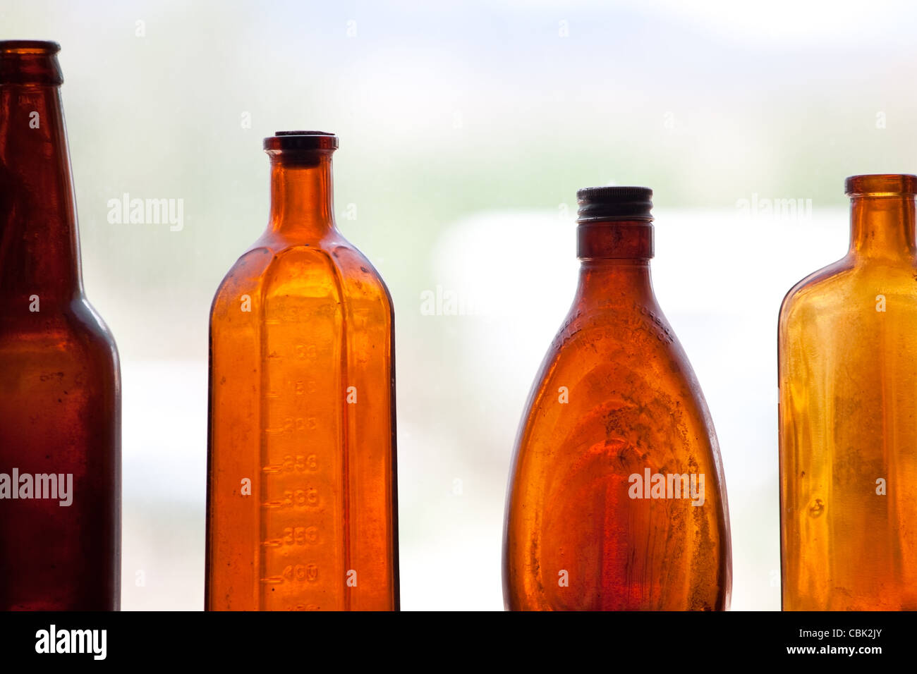 Antique Bottles in window Stock Photo