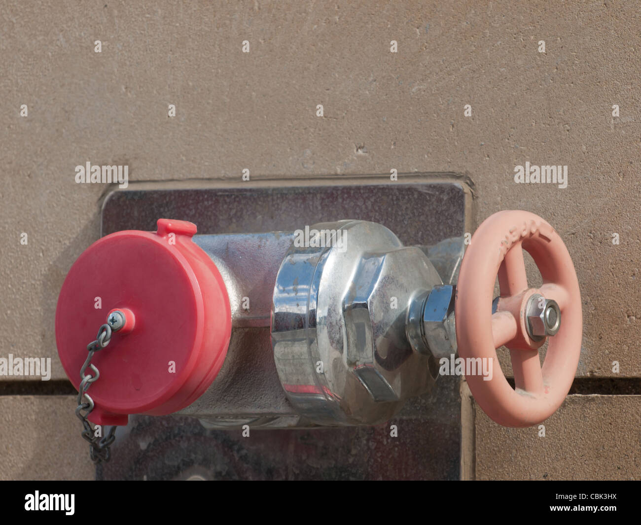 Wall mounted fire hydrant on new building Stock Photo Alamy