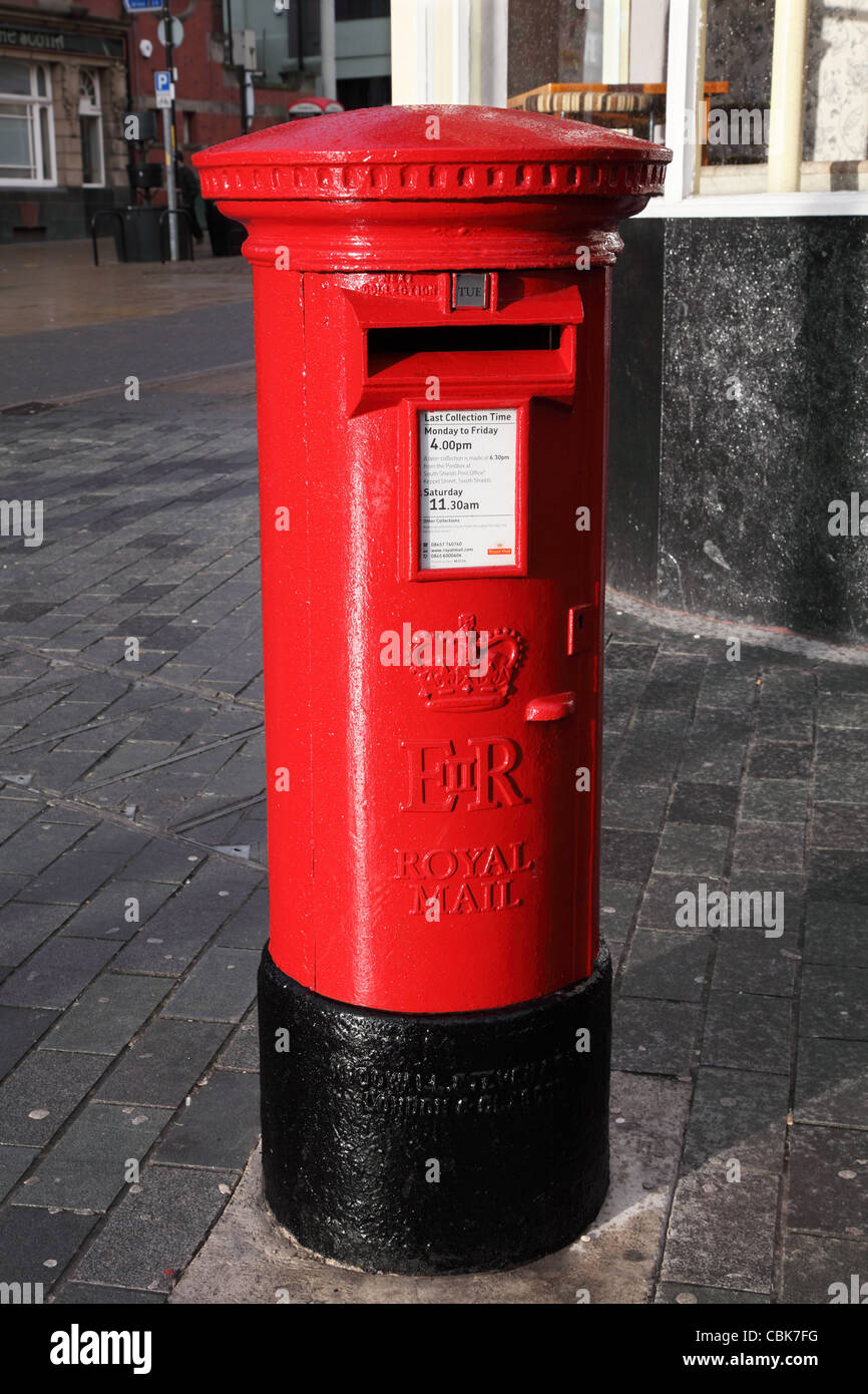 Red Royal Mail pillar or post box, South Shields, north east England, UK Stock Photo