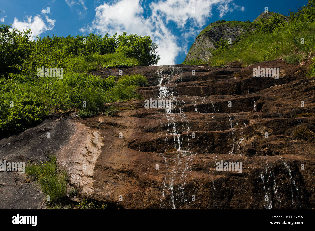 Waterfall falling from slope rocks in Austria Stock Photo - Alamy