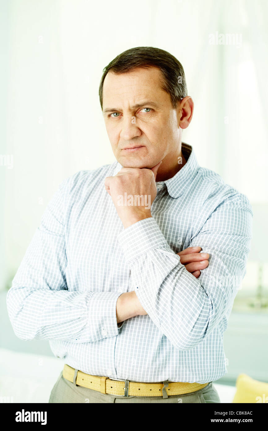 Man touching chin folded hi-res stock photography and images - Alamy