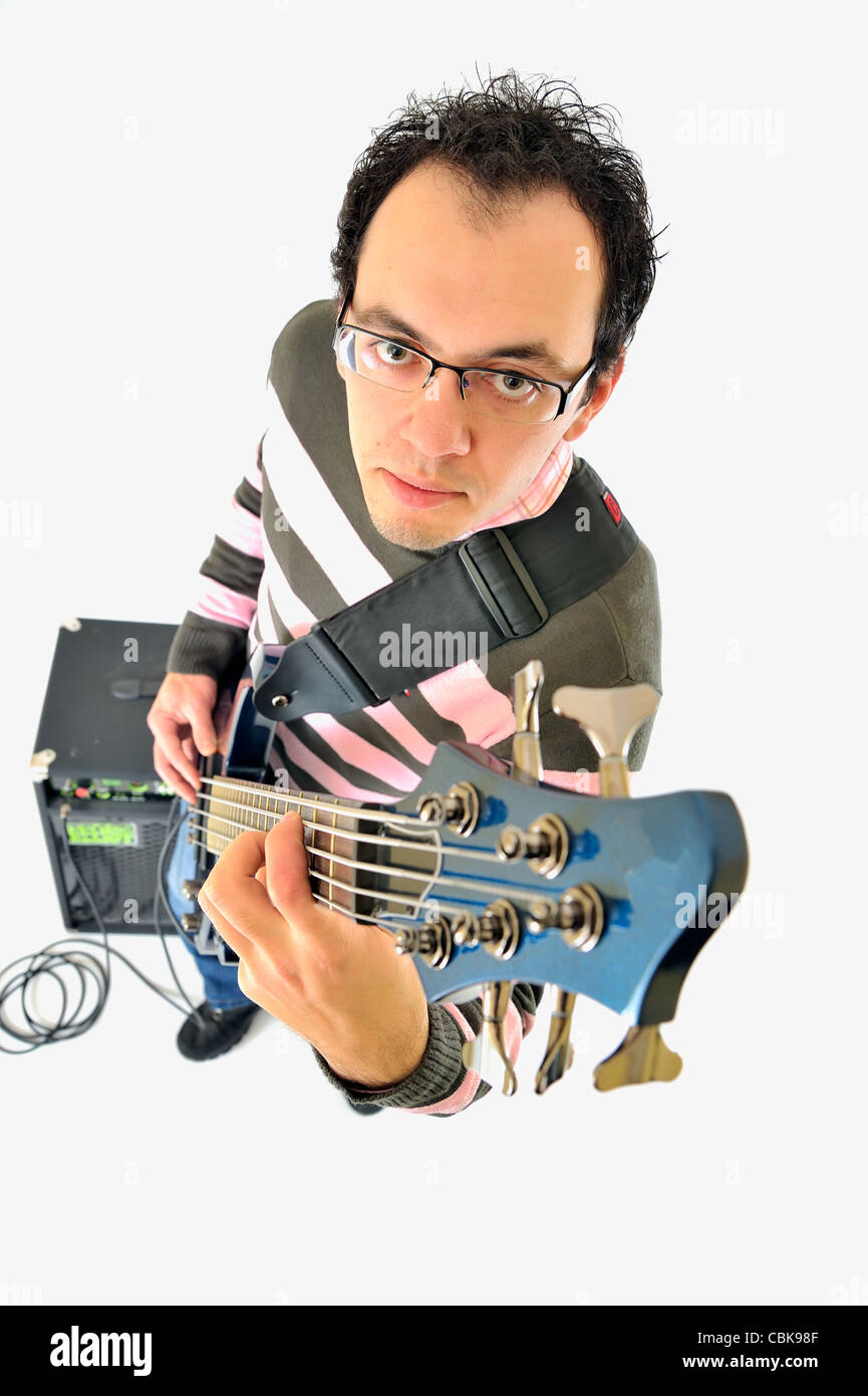Boy with bass guitar and an amp Stock Photo