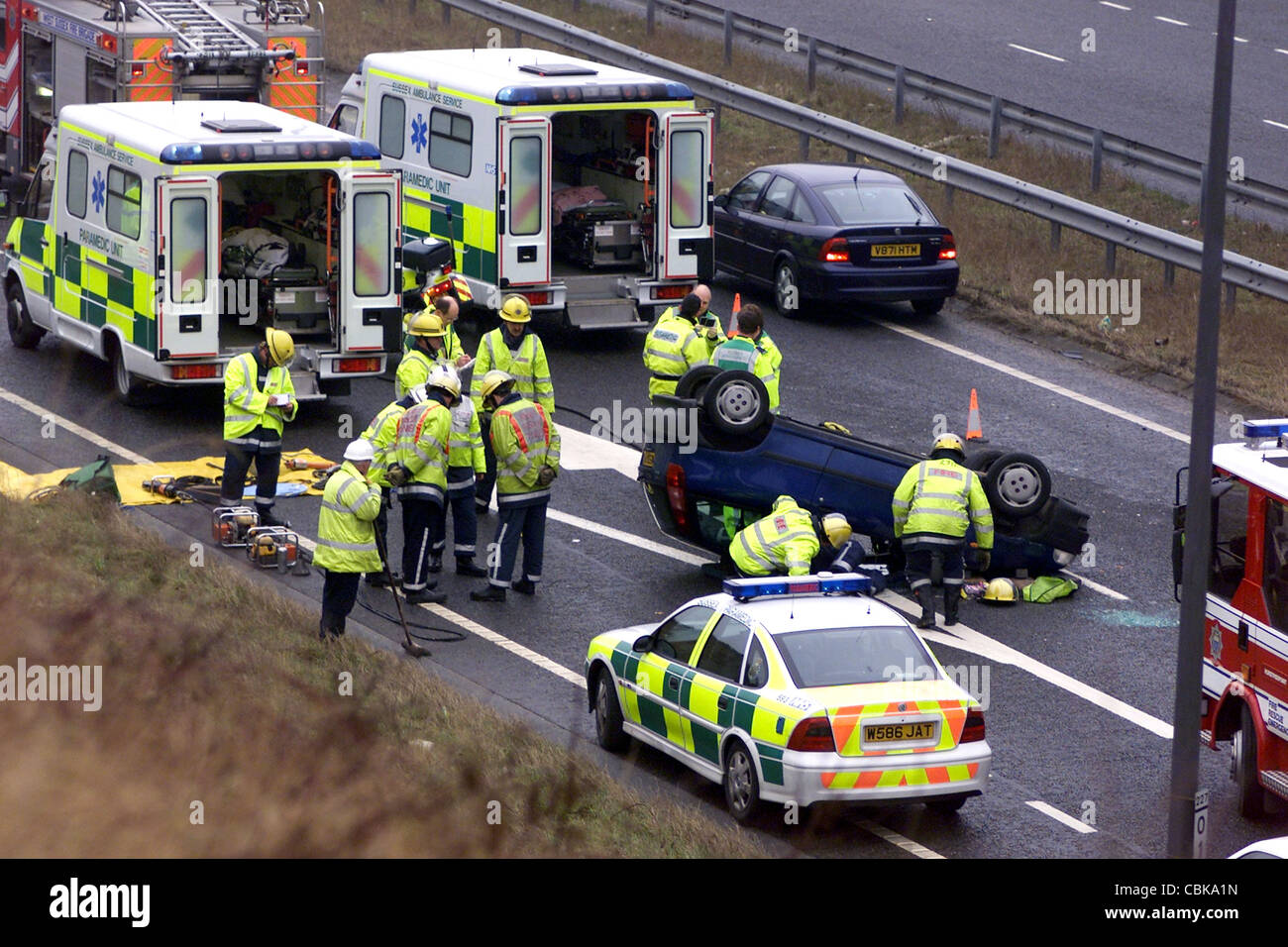 RTA INVOLVING EIGHT CARS ON THE A23 AT PYCOMBE - EMERGENCY SERVICES AT THE SCENE WHERE ONE OF THE CARS HAD OVERTURNED Stock Photo