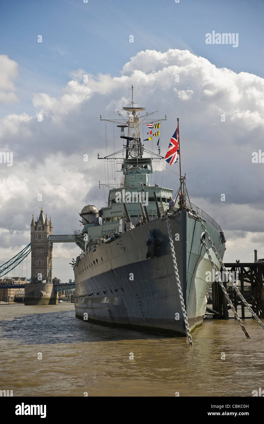 British Battleship HMS Belfast moored on the River Thames near Tower Bridge, London, UK Stock Photo