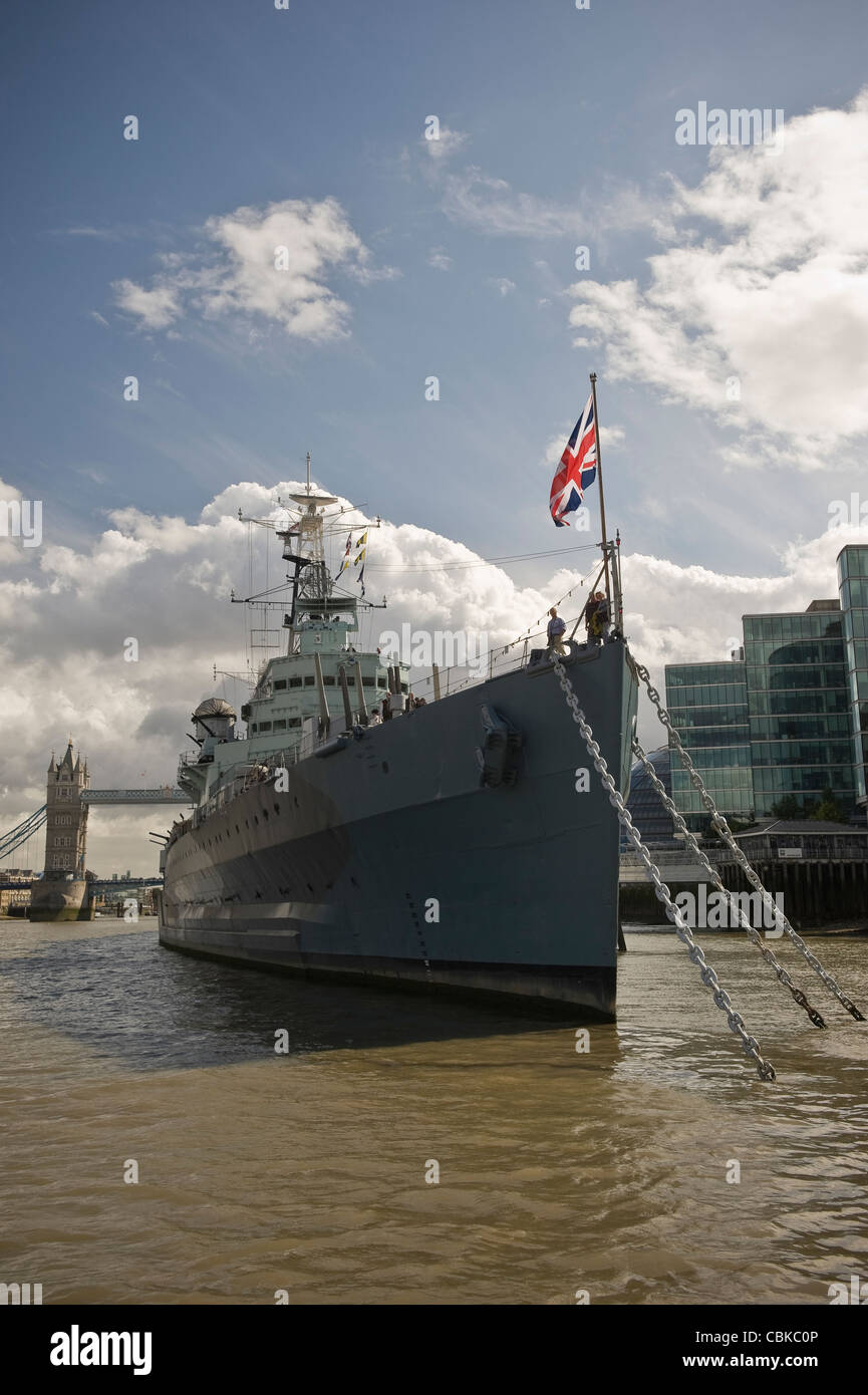 British Battleship HMS Belfast moored on the River Thames near Tower Bridge, London, UK Stock Photo
