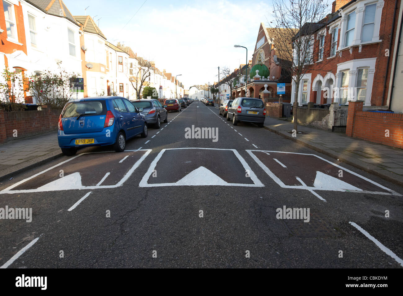 traffic calming measures sleeping policemen speed bumps in a residential street north london england united kingdom uk Stock Photo