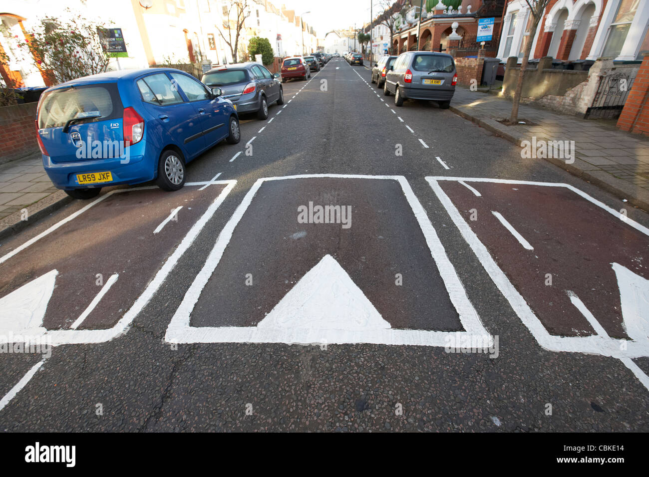 traffic calming measures sleeping policemen speed bumps in a residential street north london england united kingdom uk Stock Photo