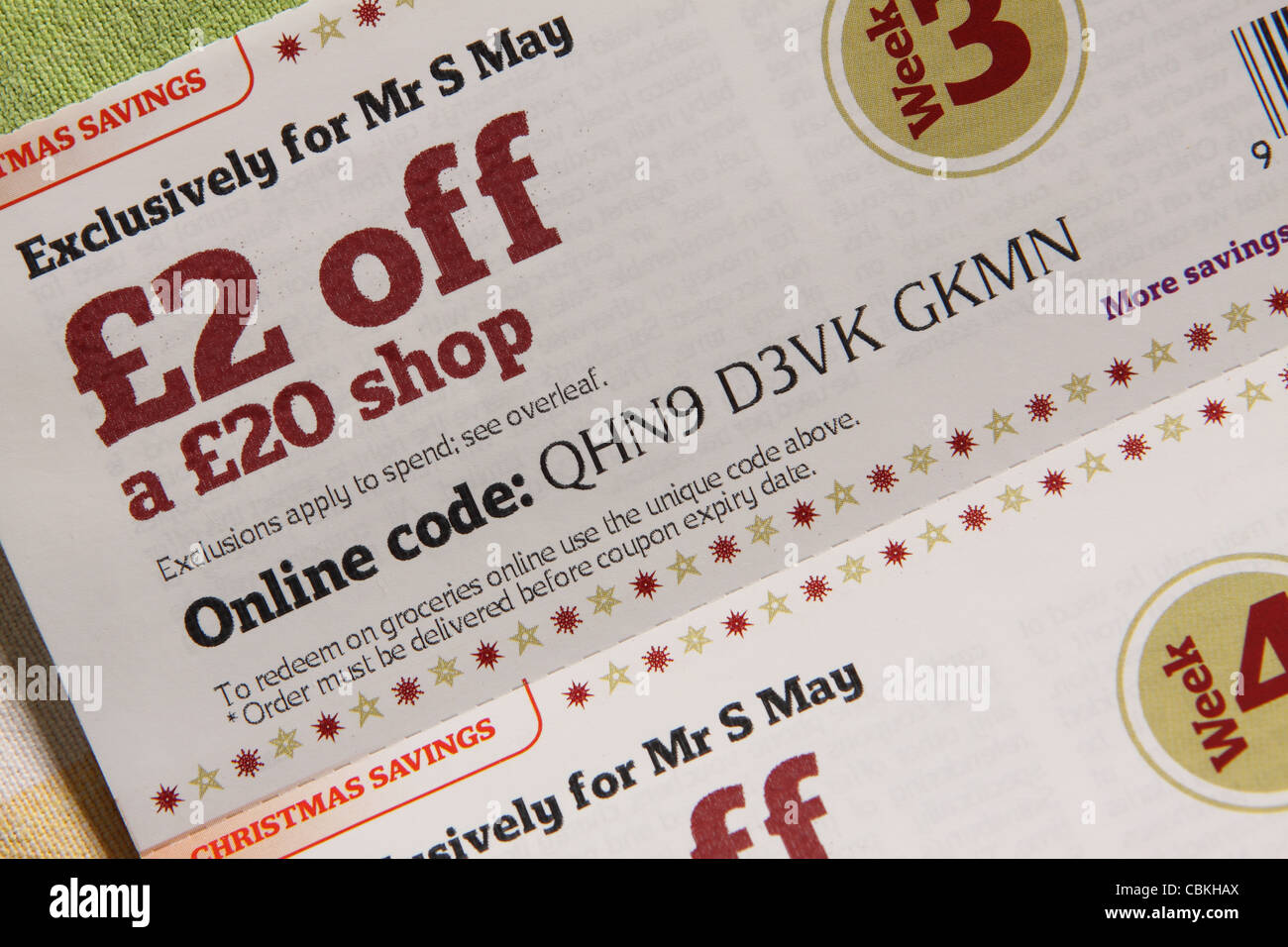 Supermarket money off loyalty voucher coupon £2 off a £20 shop saving Stock Photo