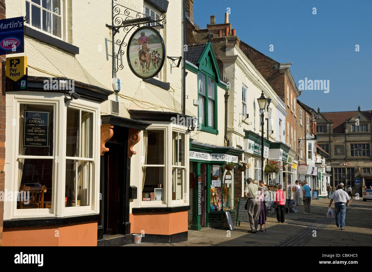 The Royal pub and shops stores Market Place Thirsk North Yorkshire England UK United Kingdom GB Great Britain Stock Photo