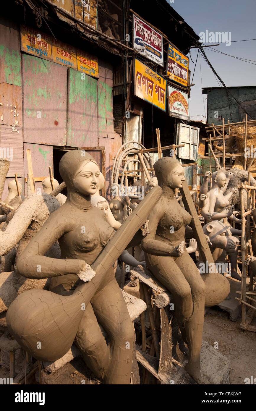 India, West Bengal, Kolkata, Kumartuli, sculptors’ enclave, part-completed clay puja effigies of Goddess Saraswati Stock Photo