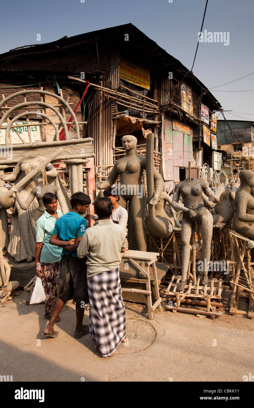 India, West Bengal, Kolkata, Kumartuli, sculptors’ enclave, part-completed clay puja effigies of deities Stock Photo
