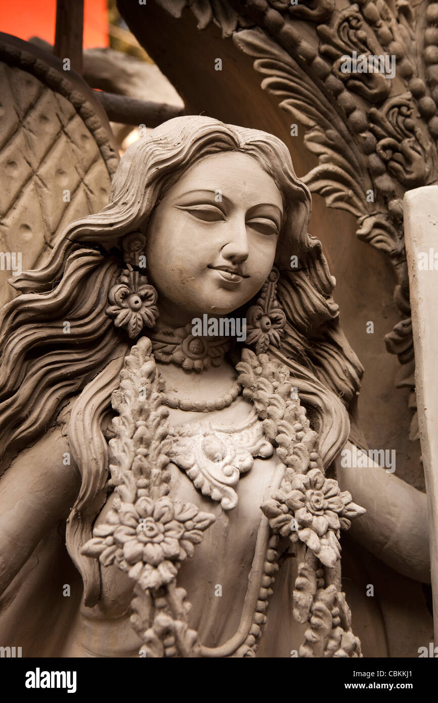 India, West Bengal, Kolkata, Kumartuli, sculptors’ enclave, clay puja of female Goddess Saraswati awaiting painting Stock Photo