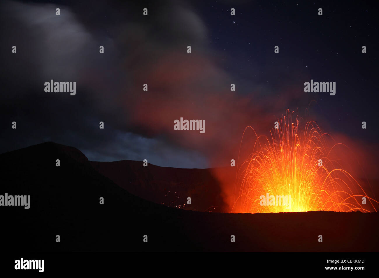 June 2, 2010 - Strombolian eruption on starlit night, Yasur Volcano, Tanna Island, Vanuatu. Stock Photo