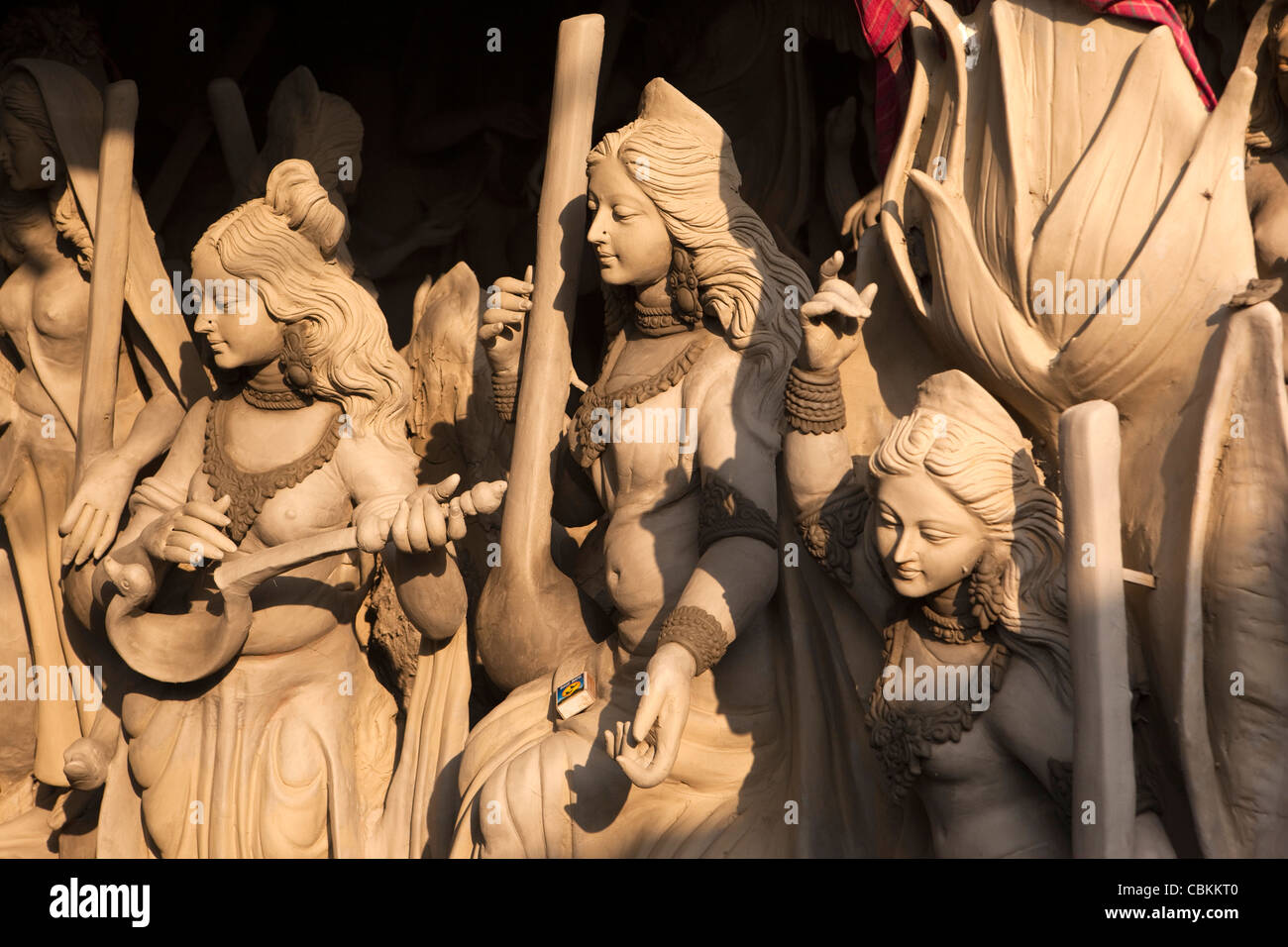 India, West Bengal, Kolkata, Kumartuli, sculptors’ enclave, clay puja effigies of female Goddess Saraswati awaiting painting Stock Photo