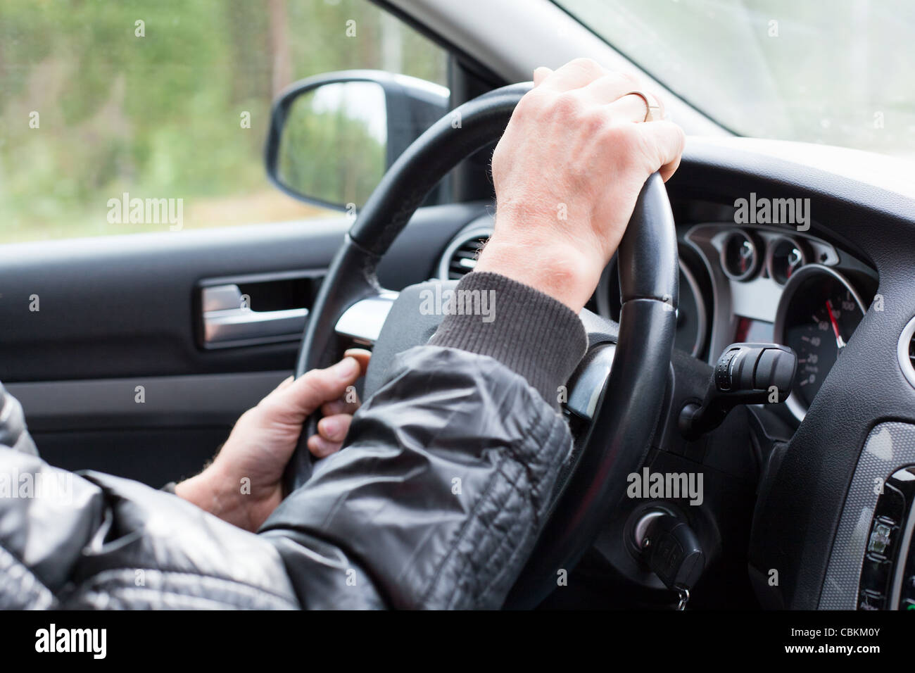 Male hands on steering wheel. Driving a car. Close up Stock Photo Alamy