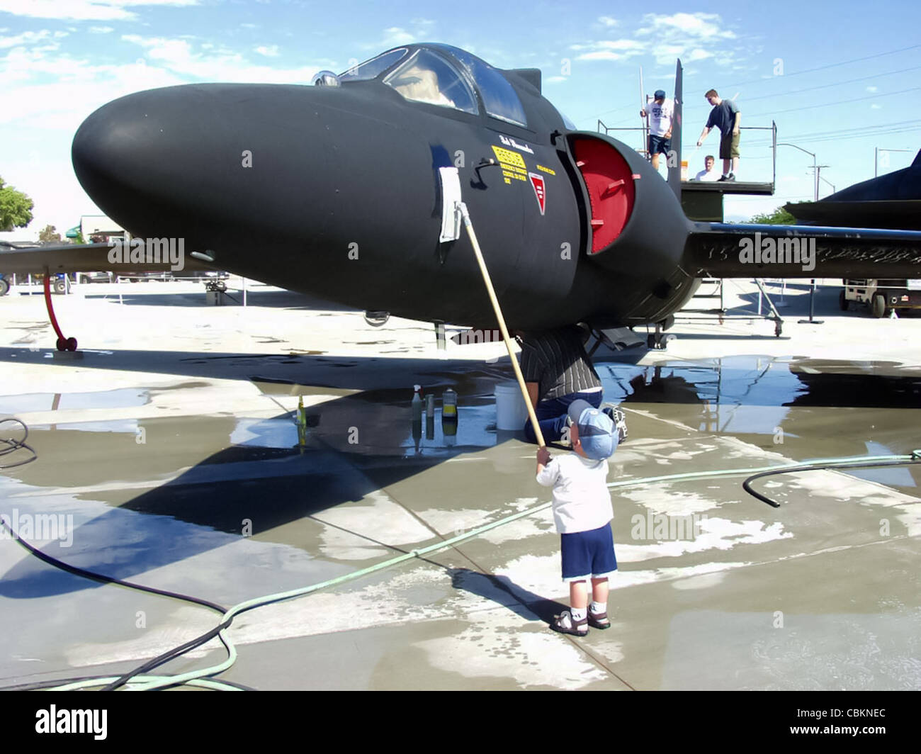 EDWARDS AIR FORCE BASE, Calif. -- A future airman of 410th Flight Test Squadron here washes a U-2D Dragon Lady at the Blackbird Airpark in the nearby city of Palmdale. Stock Photo
