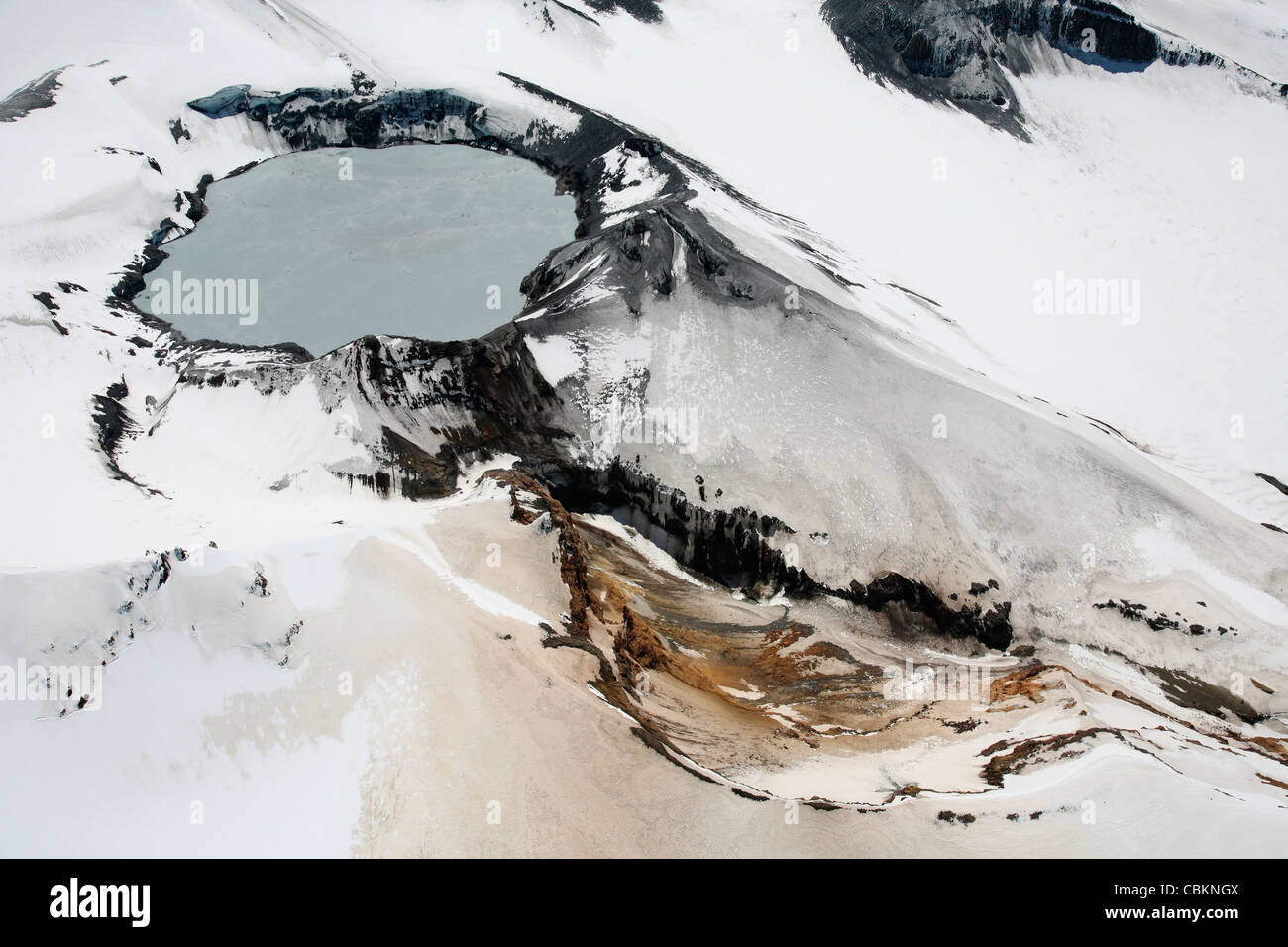 November 2007 - Aerial view of snow-covered Ruapehu volcano summit crater with acidic lake, New Zealand. Stock Photo