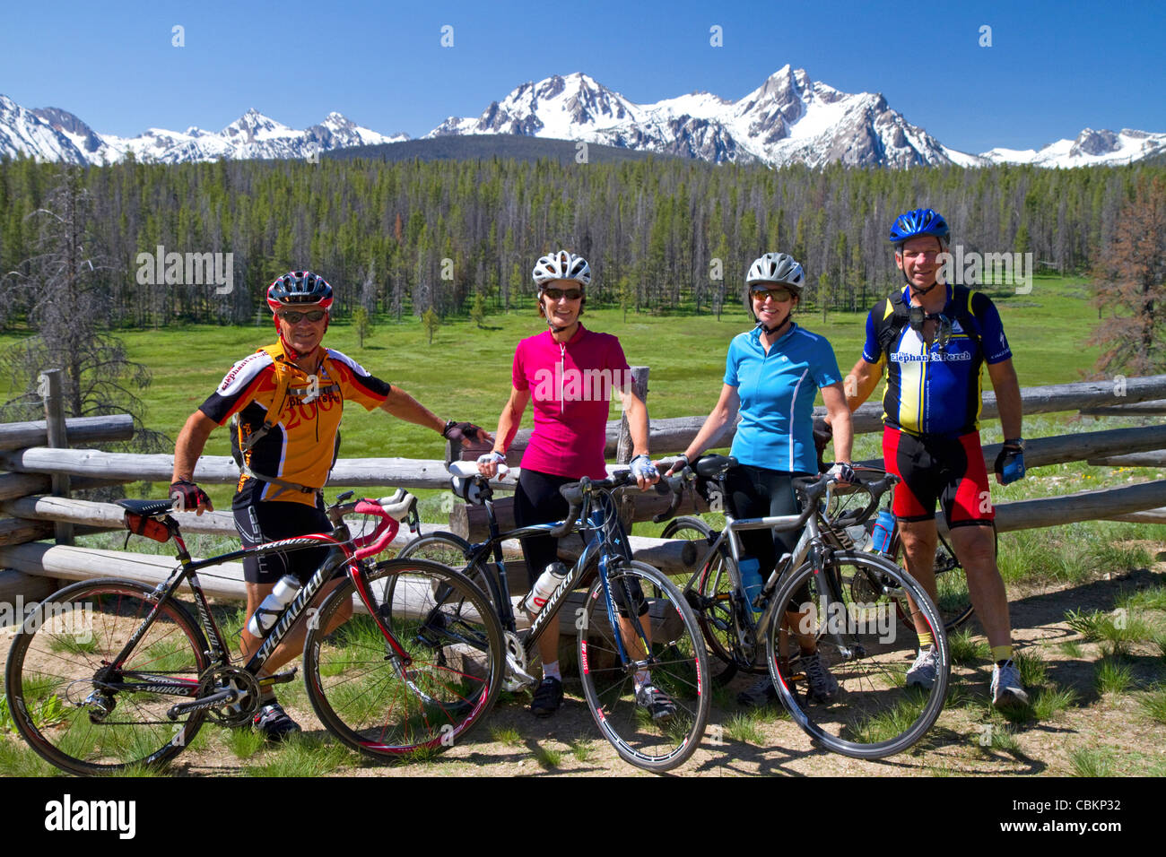 Touring bicyclists stop for a view of the Sawtooth Mountain Range near Stanley, Idaho, USA. Stock Photo