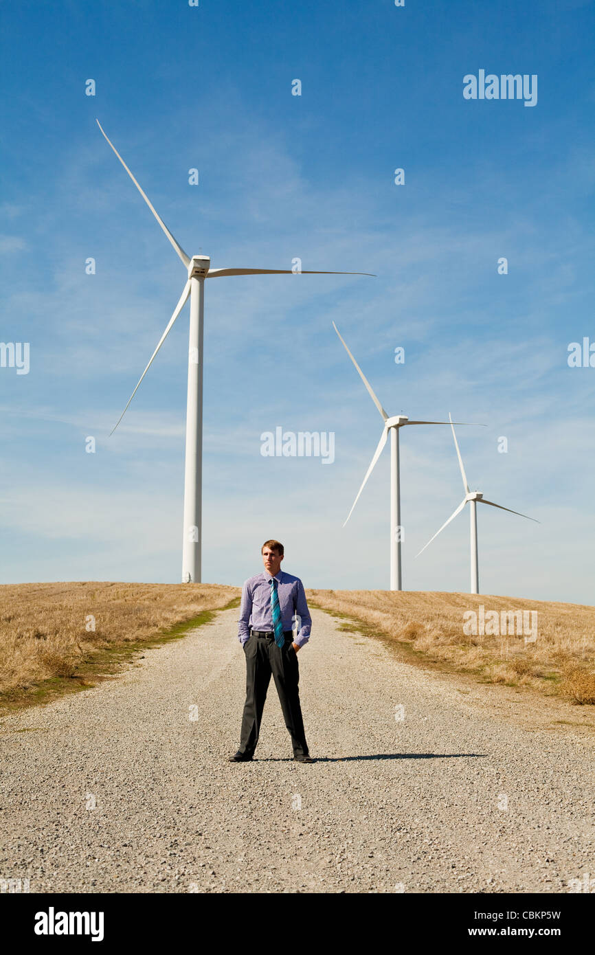 Man in front of wind turbines Stock Photo