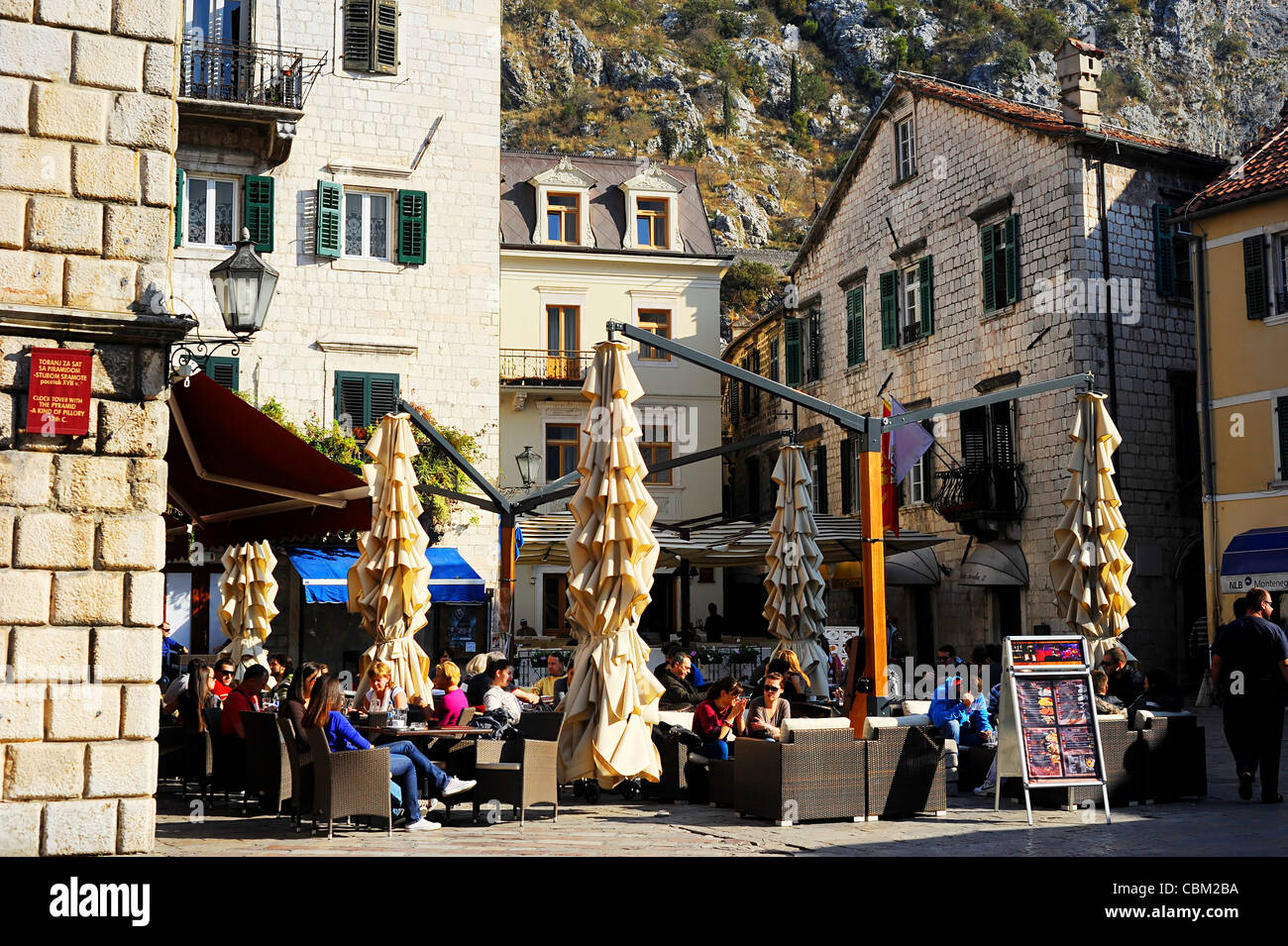 Street cafe in Kotor old town. Kotor has one of the best preserved medieval old towns in the Adriatic and is a UNESCO world heri Stock Photo