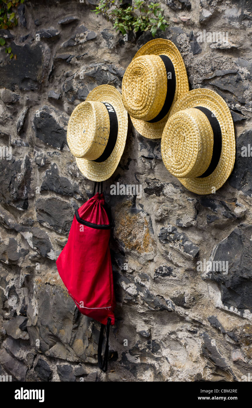 Madeira toboggan driver straw hats Stock Photo