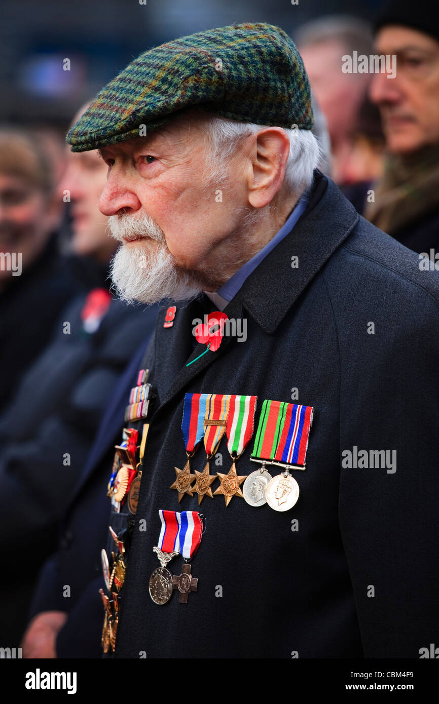Veteran soldier wearing his war medals, attending a Remembrance Stock