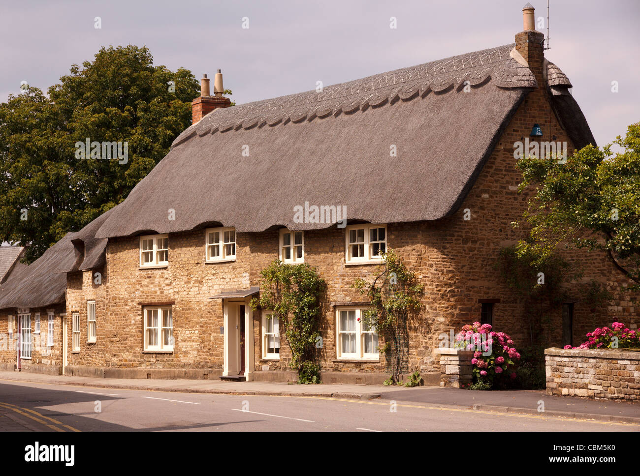 The Old Manor House English thatched stone cottage, Northgate Street, Oakham, Rutland, England, UK Stock Photo