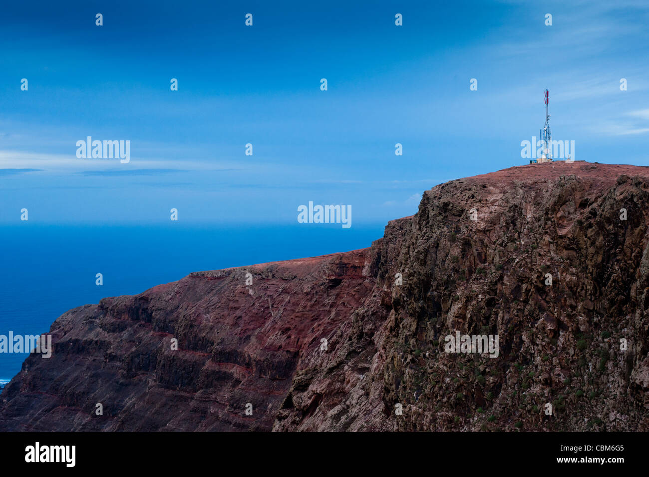 Communications tower as seen at dawn on a windy day from Mirador del Río, Lanzarote, Canary Islands, Spain. Stock Photo