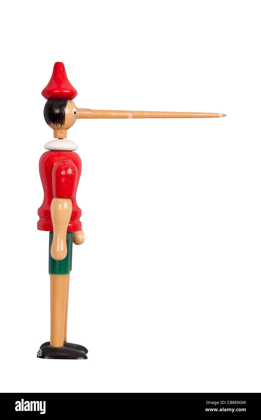 Wooden Pinocchio doll with long nose isolated on white Stock Photo
