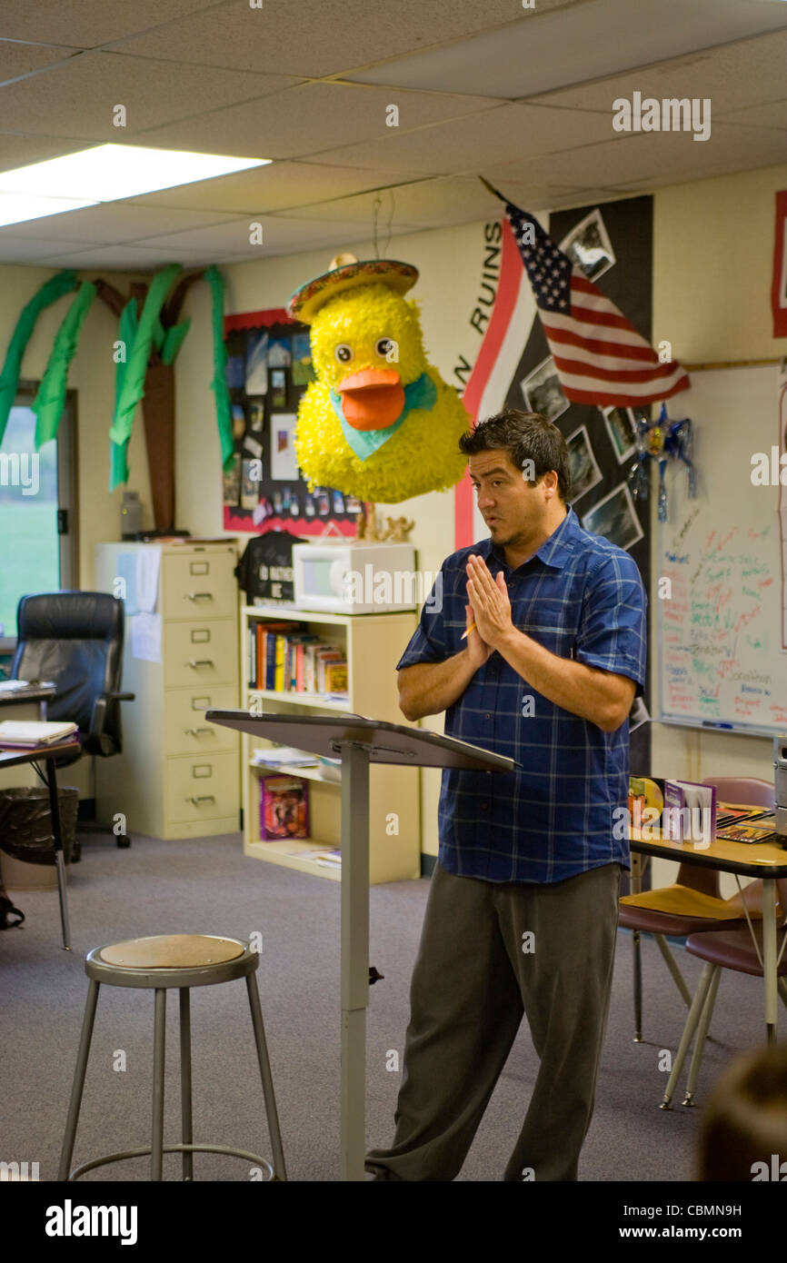 A California middle school Spanish teacher in a classroom decorated with a pinata. Stock Photo