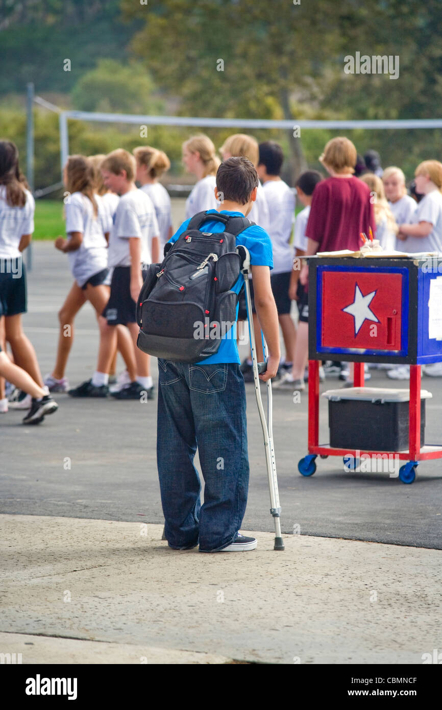 On crutches and unable to participate, a handicapped California middle
