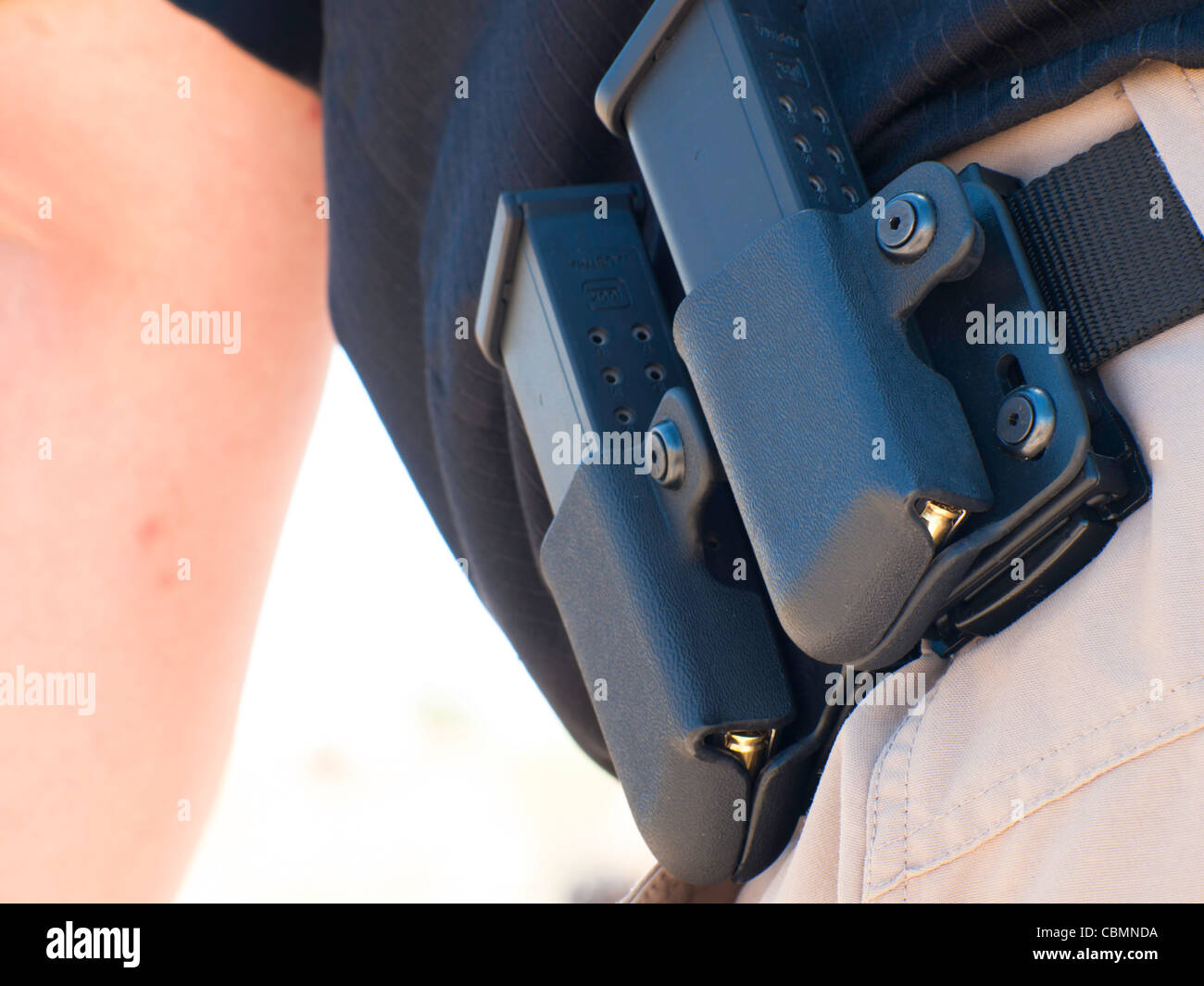 Bullet magazines on man's belt Stock Photo - Alamy