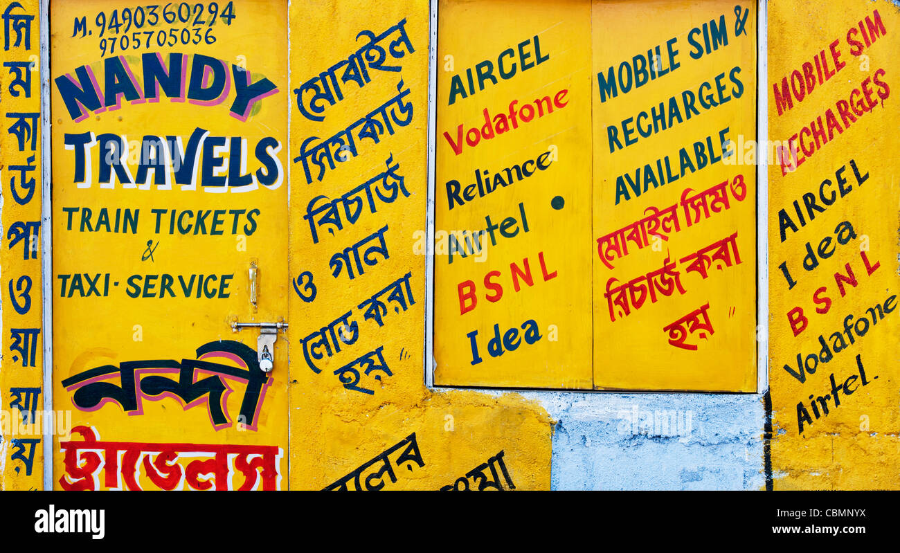 Painted indian travel and mobile network signs on a wall. Andhra Pradesh, India Stock Photo