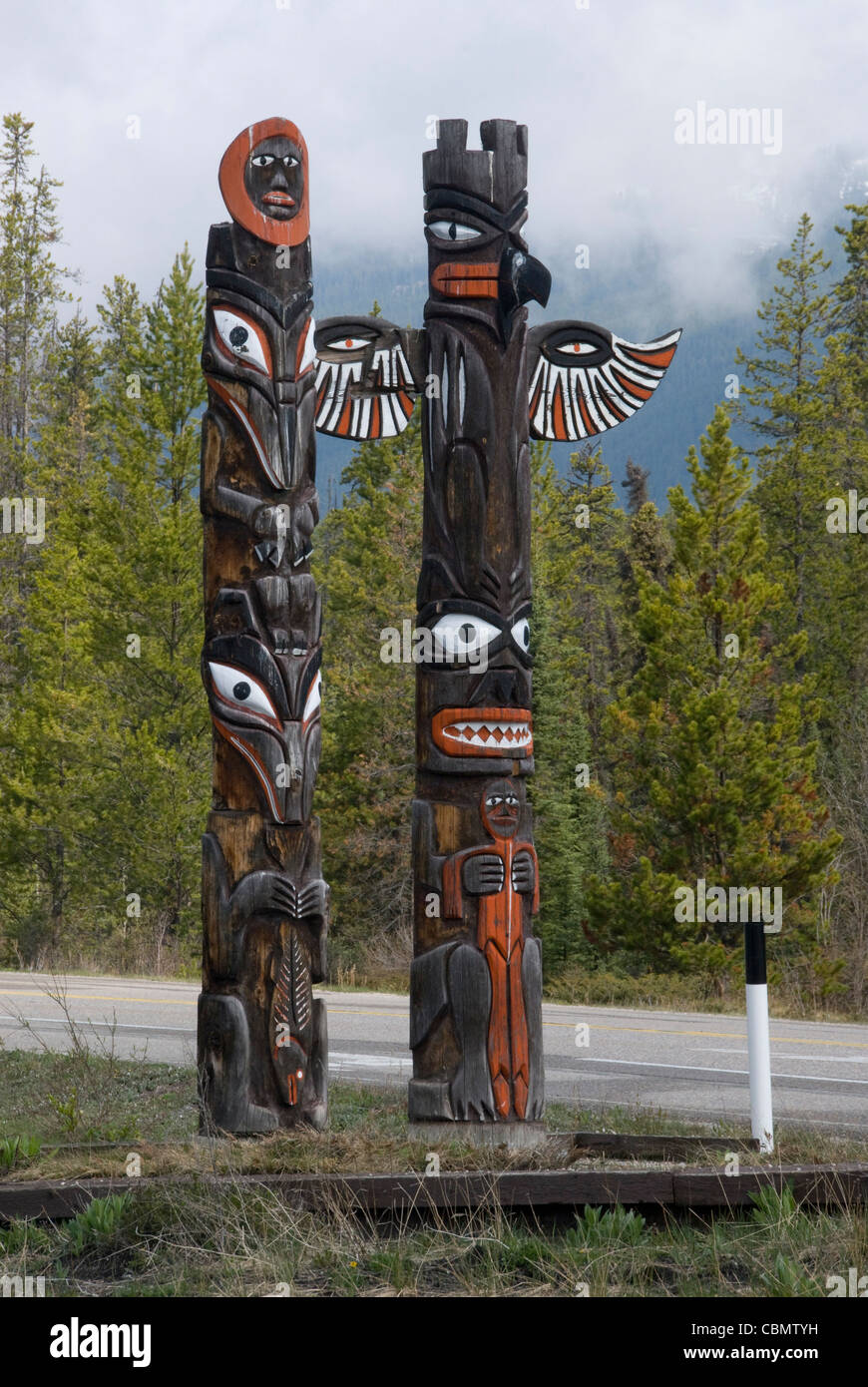 Totem poles beside road, near Jasper, Alberta, Canada Stock Photo - Alamy