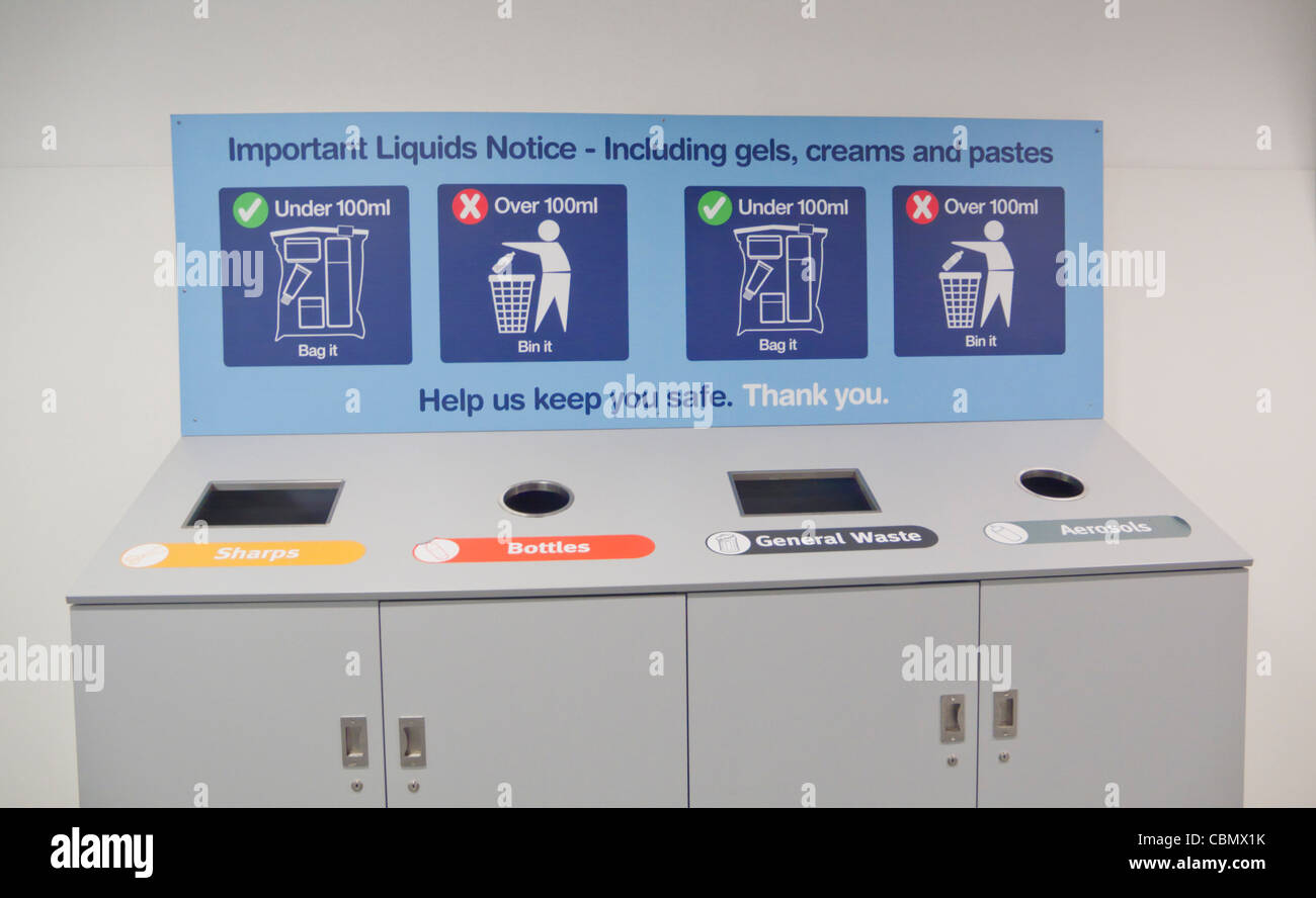 Liquids disposal bins at Airport due to airline flight 100ml bottle size regulations Stock Photo