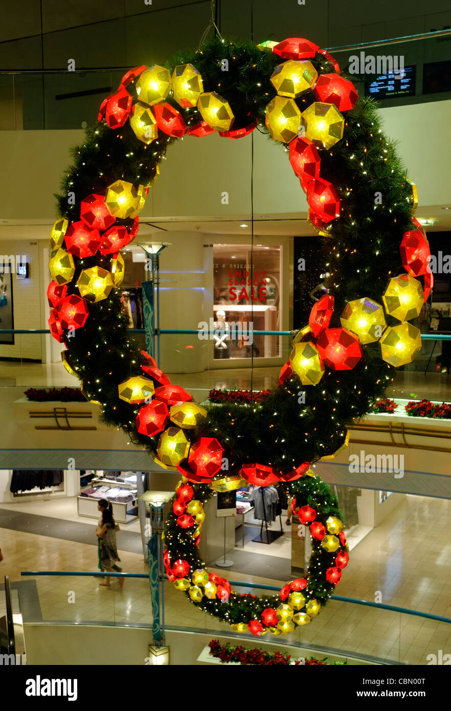 Illuminated Christmas garlands form the decorations for Raffles City shopping mall in Singapore Stock Photo