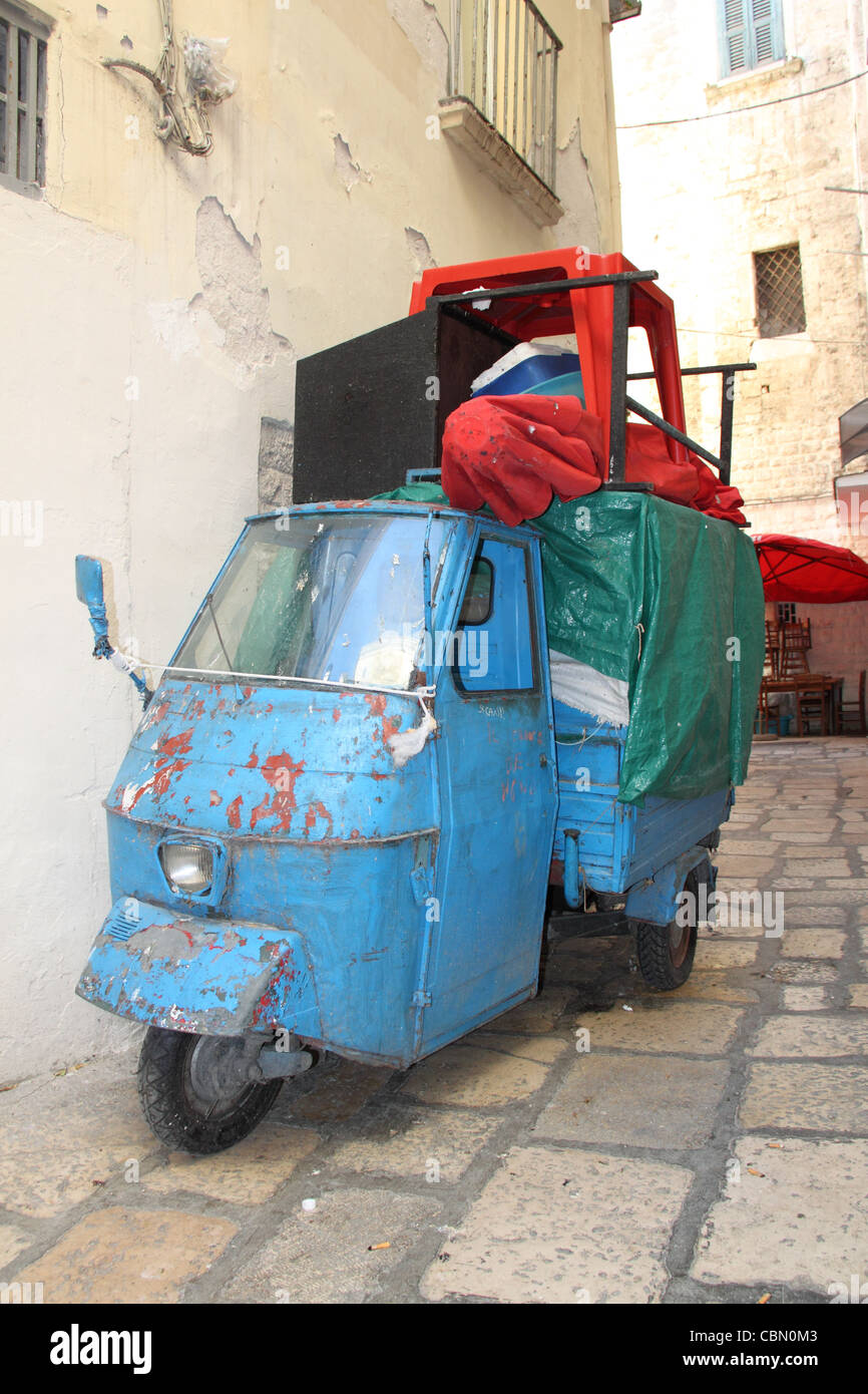 Overloaded Piaggio Ape three-wheeler in narrow old town street, Bari Vecchia, Apulia, Puglia, Italy, Italia, Italie, Adriatic Sea, Europe Stock Photo