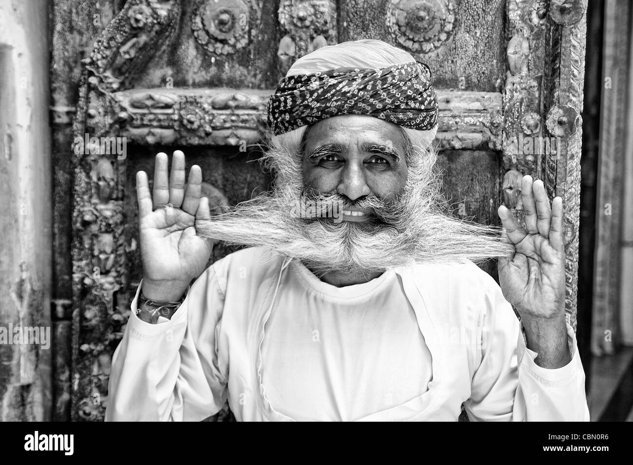 Jodhpur at Fort Mehrangarh in Rajasthan India a great image of bearded character man guard in doorway of Fort Palace in costume Stock Photo