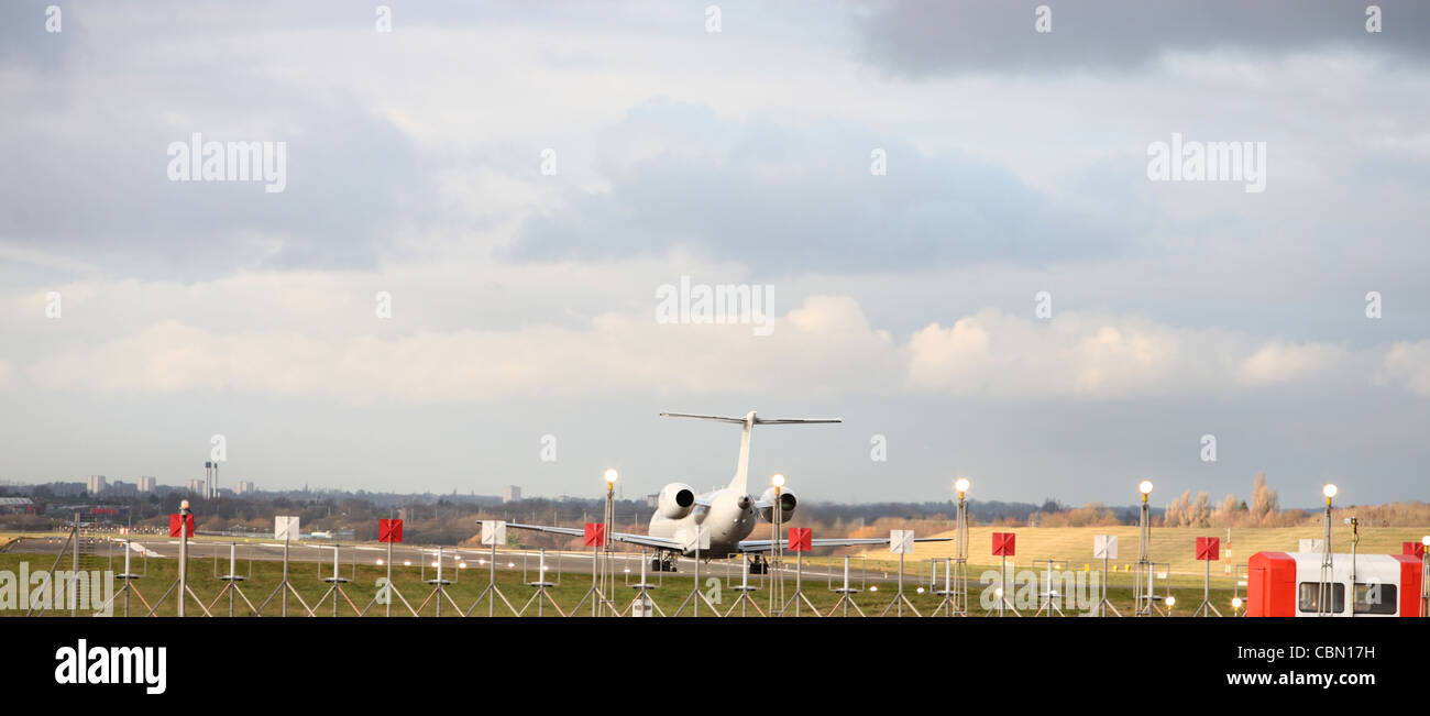 Passenger jet preparing take off from Birmingham international airport Stock Photo